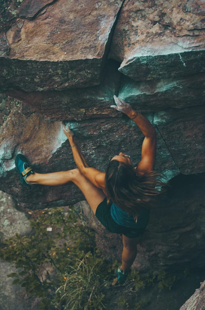 woman climbing mountain